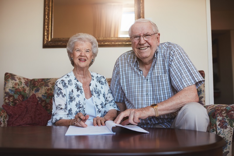 a person and person sitting at a table.