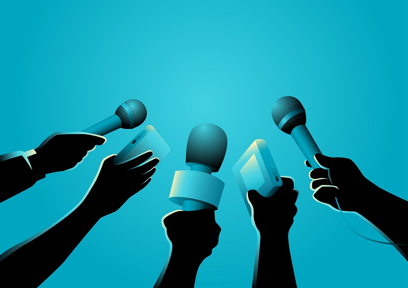 a group of hands holding microphones.