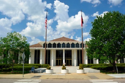 Georgia Governor's Mansion with flags on poles.