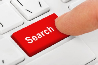 a finger pressing a red search button. Containing the words: search