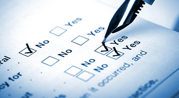 a close-up of a pen filling out a questionnaire.