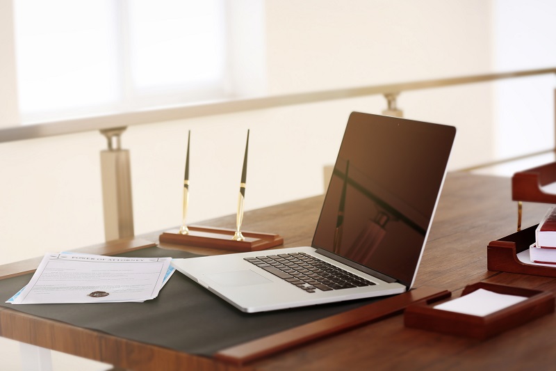 a laptop on a desk.