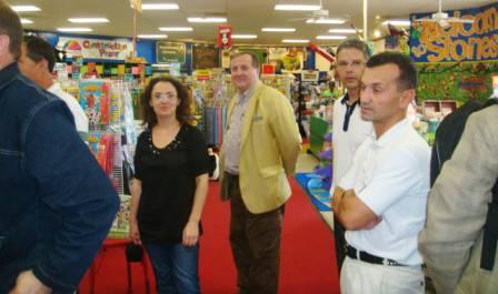 a group of people standing in a store.