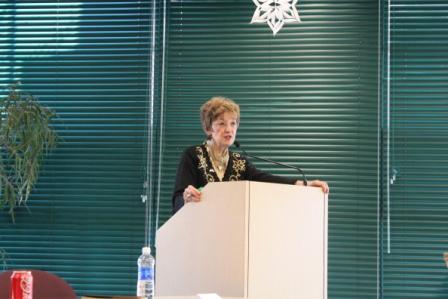 a person speaking at a podium.