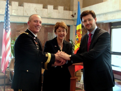 a group of people in suits shaking hands.