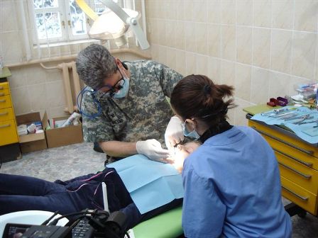 a person and person in a dental office.