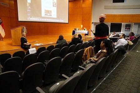 a person giving a presentation to a group of people.