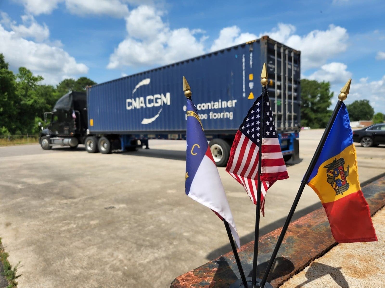 flags next to a truck.