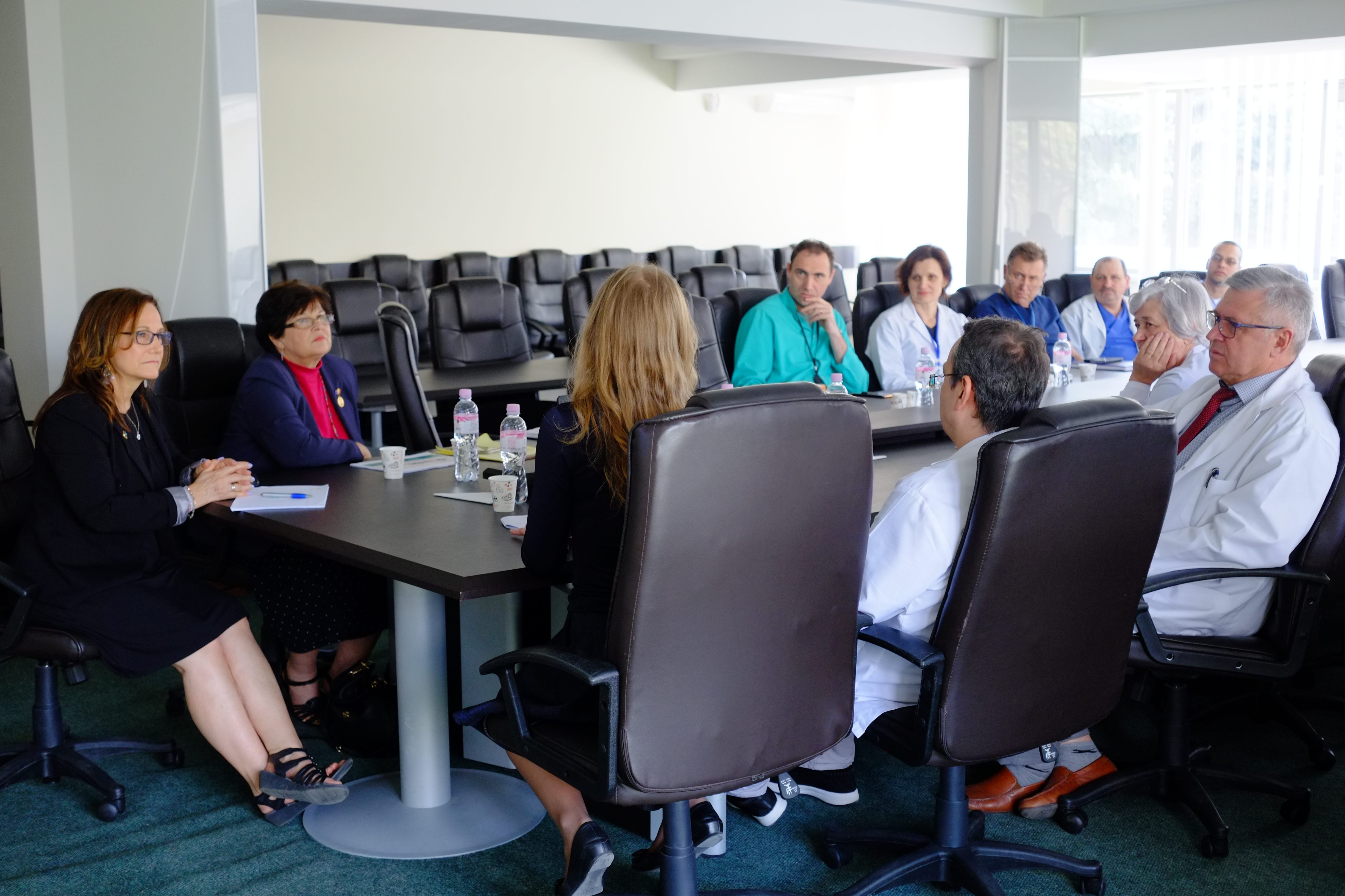 a group of people sitting at a table.